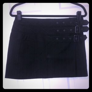 Stylish pinstripe mini skirt with side buckles.